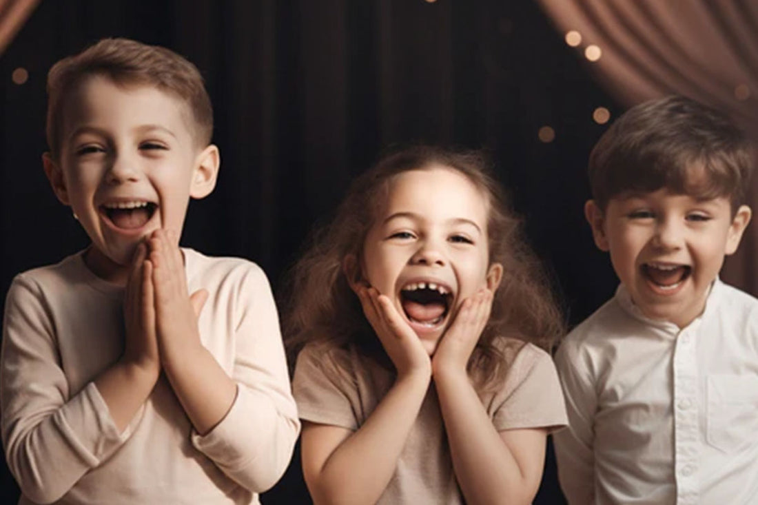 Three happy kids smiling.