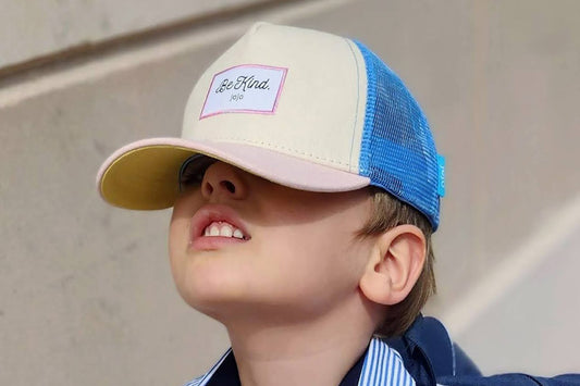 A kid goes to school in a cool cap.
